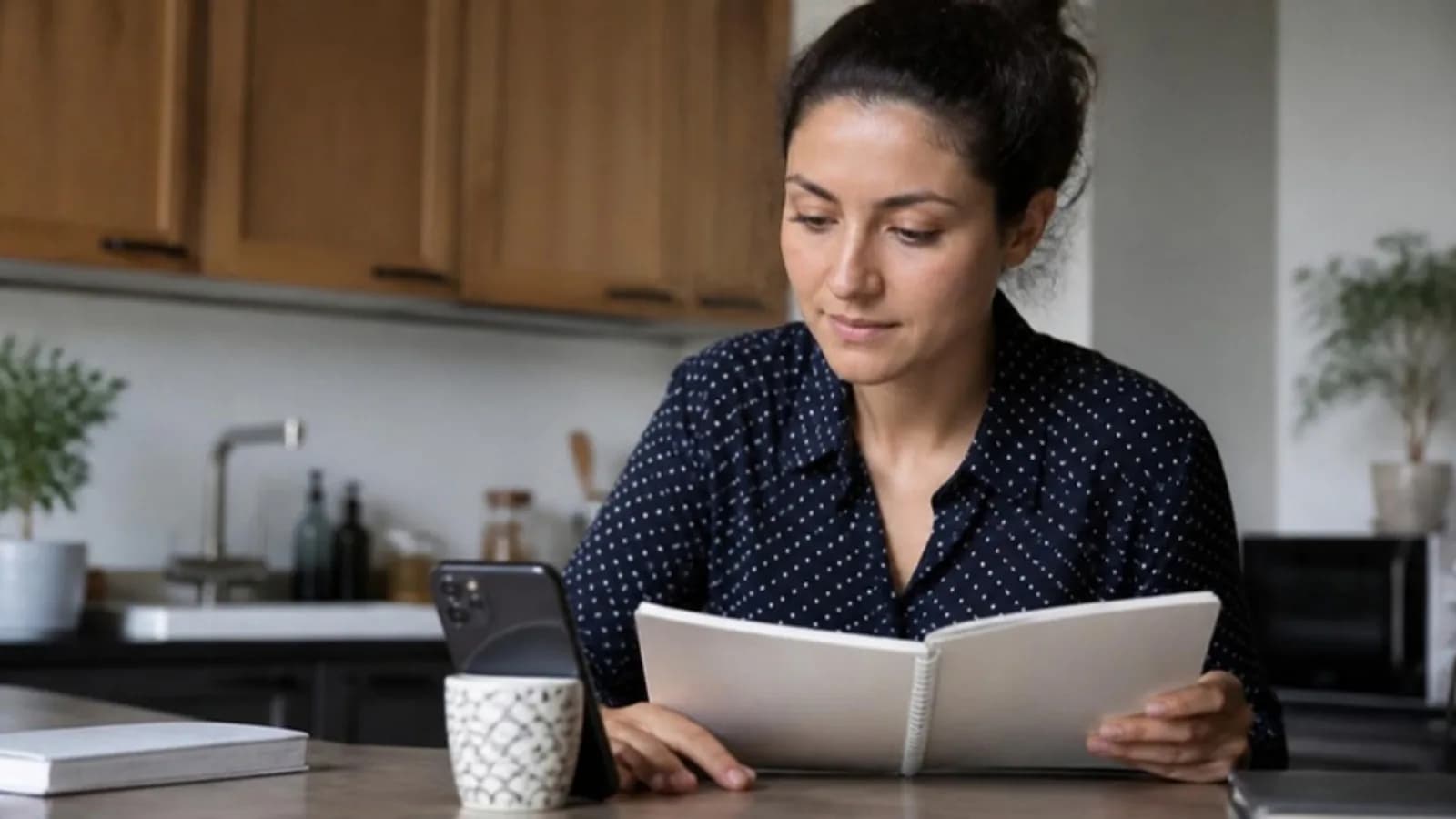 Preparing for a job interview at home with notes and a phone
